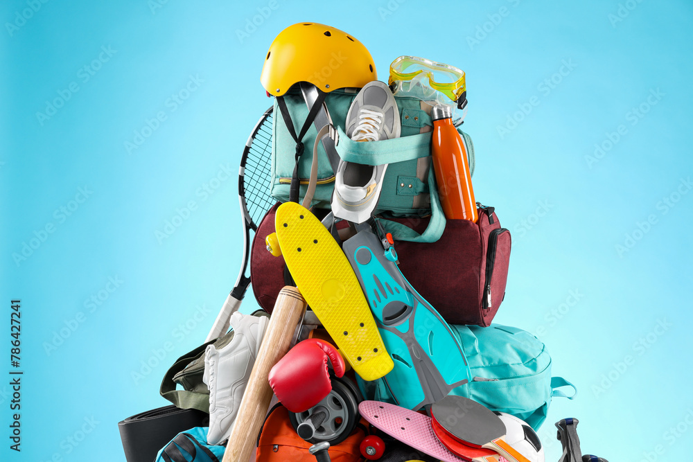 Many different sports equipment on light blue background Many different sports equipment on light blue background