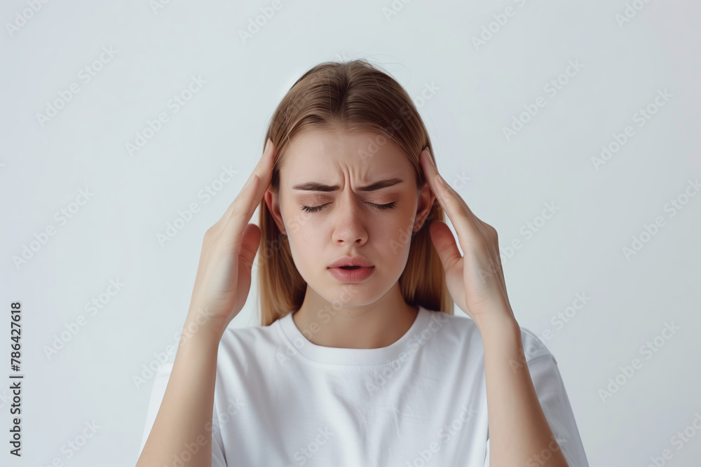 Portrait of girl feeling headache, migraine or being ill, standing on white background. Copy space Portrait of girl feeling headache, migraine or being ill, standing on white background. Copy space
