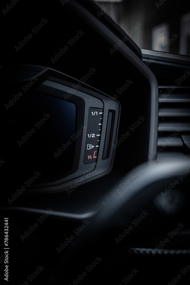 Car fuel gauge close-up. Car dashboard. Car interior