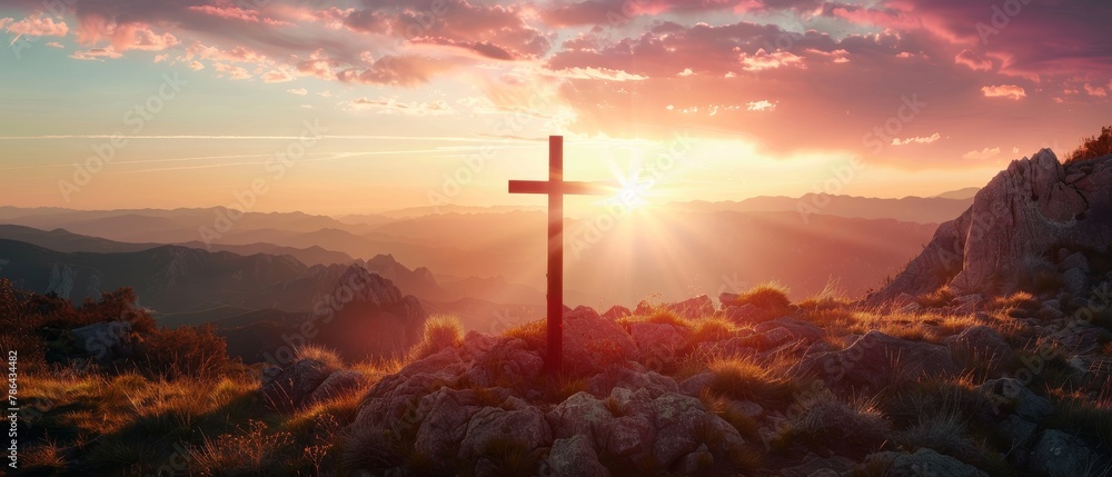 Jesus' crucifix symbolizes the love of God on a sunset sky mountain background - obrazy, fototapety, plakaty 