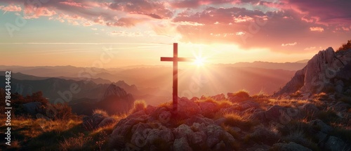 Jesus' crucifix symbolizes the love of God on a sunset sky mountain background photo