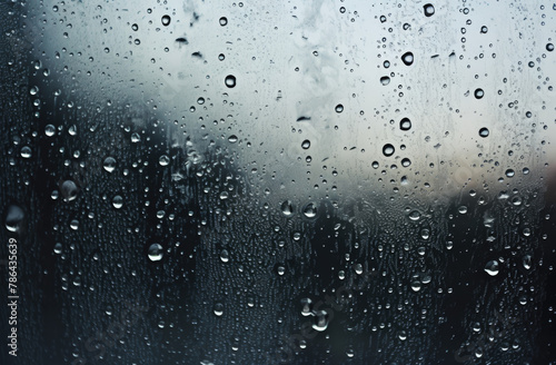 Black and Grey background with transparent glass and raindrops  creating a captivating scene of elegance and tranquility  reminiscent of a rainy day s beauty