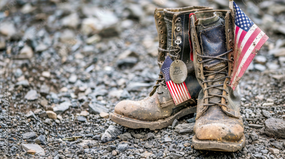 Old military combat boots with dog tags and a small American flag ...