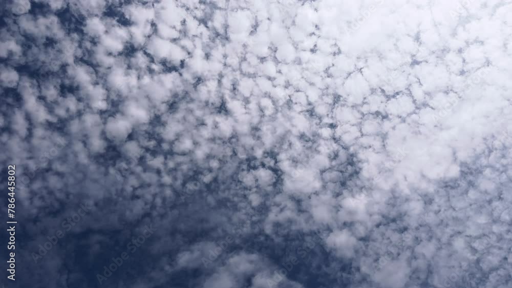 Altocumulus clouds flowing in the blue sky. Cloudscape time-lapse footage. Altocumulus clouds flowing in the blue sky. Cloudscape time-lapse footage.