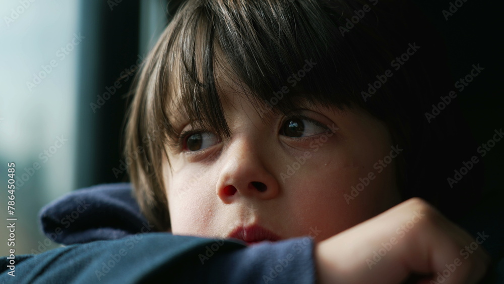 Pensive Child with Close-Up of Eyes and Face While Traveling by Train, Contemplative Gaze and Thoughtful Expression, Small Boy Staring at Landscape Lost in Thought