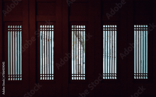 A spectacular pattern of illumination from the grid windows on Chinese foldable sheet doors of Jigu Library in Benyuan Lin s family manse at Banqiao  New Taipei City  Taiwan.