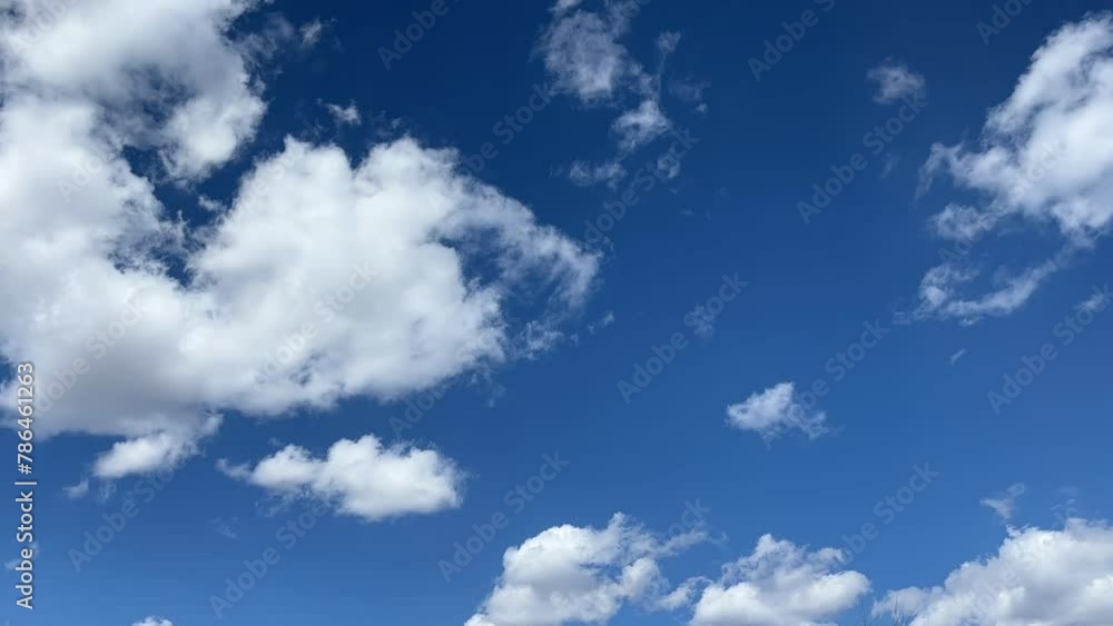 Blue sky with big white clouds. Puffy fluffy cumulus cloudscape time lapse. Nature weather Blue sky with big white clouds. Puffy fluffy cumulus cloudscape time lapse. Nature weather