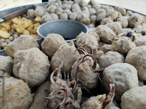 Bakso or baso is an Indonesian meatball, or a meat paste made from beef surimi. Its texture is similar to the Chinese beef ball, fish ball, or pork ball. Pentol or cilok is a type of flour meatball.  photo