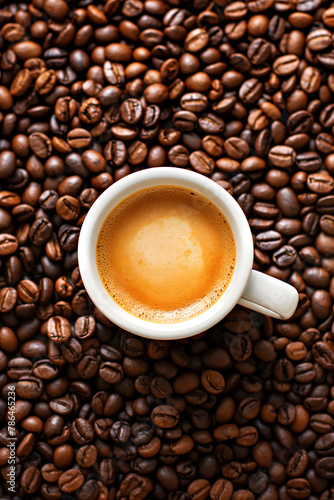 Freshly Brewed Coffee in a Black Cup Surrounded by Coffee Beans