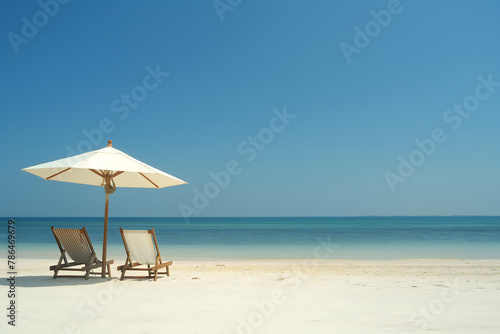 Serene Beach Vacation Scene with Umbrella and Chairs © slonme