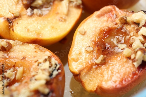 Delicious baked quinces with nuts and honey, closeup © New Africa