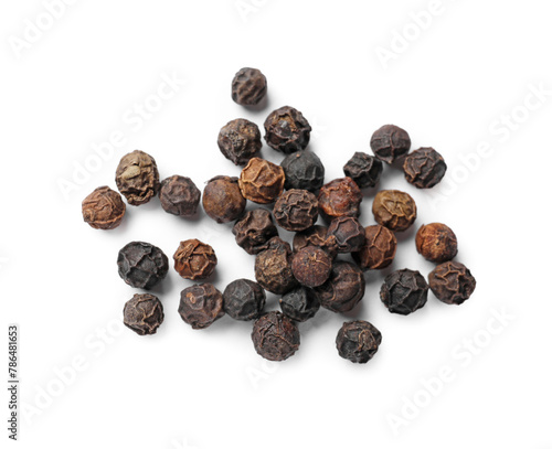 Aromatic spice. Many black dry peppercorns isolated on white, top view