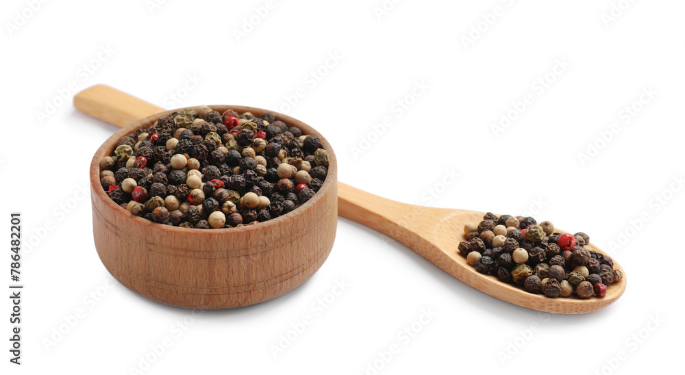 Aromatic spices. Different peppers in wooden spoon and bowl isolated on white Aromatic spices. Different peppers in wooden spoon and bowl isolated on white