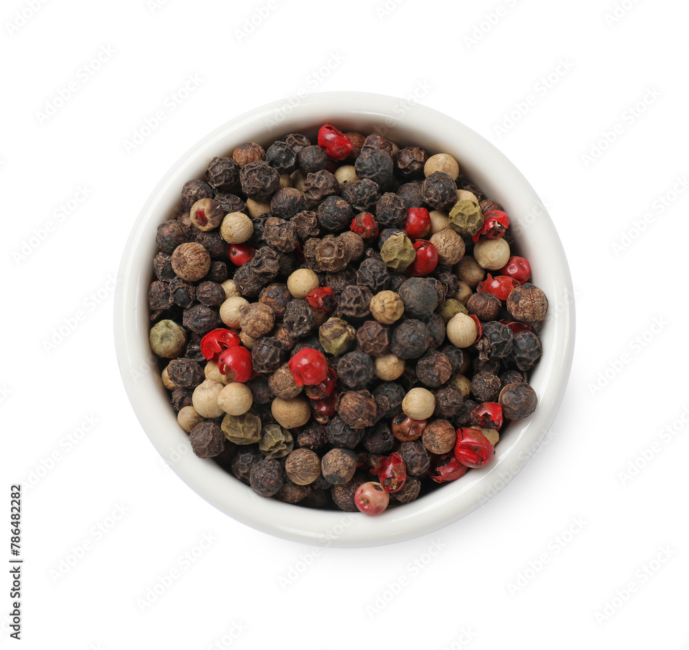 Aromatic spices. Different peppers in bowl isolated on white, top view Aromatic spices. Different peppers in bowl isolated on white, top view