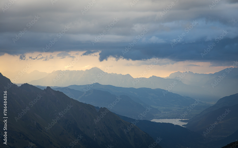 Mystic mood with mountain layers and rays of sun. Hohe Tauern mountain range in the austrian alps.