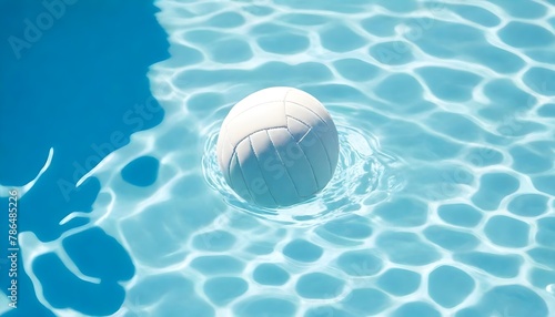 White volleyball floating in a pool with clear blue water