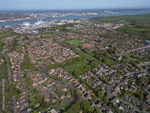 Marchwood village. High altitude aerial view of the streets and residential houses towards Marchwood Power Station and Southampton, UK.