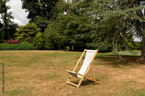 Deck chair in the park on sunny day