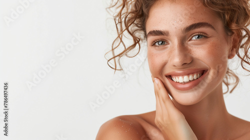 High-resolution cropped photograph showcasing skincare and cosmetics concept, featuring ample space for text. A woman with a stunning visage gently caresses her radiant, healthy facial skin in the por