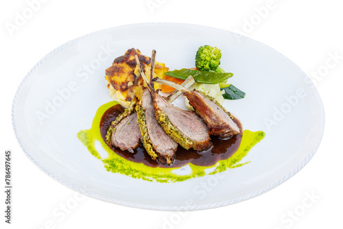 Grilled lamb chops with vegetables and piquant caramel sauce. Isolated on a white background.