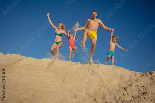Excited family's sand dune adventure in Portugal ocean coast