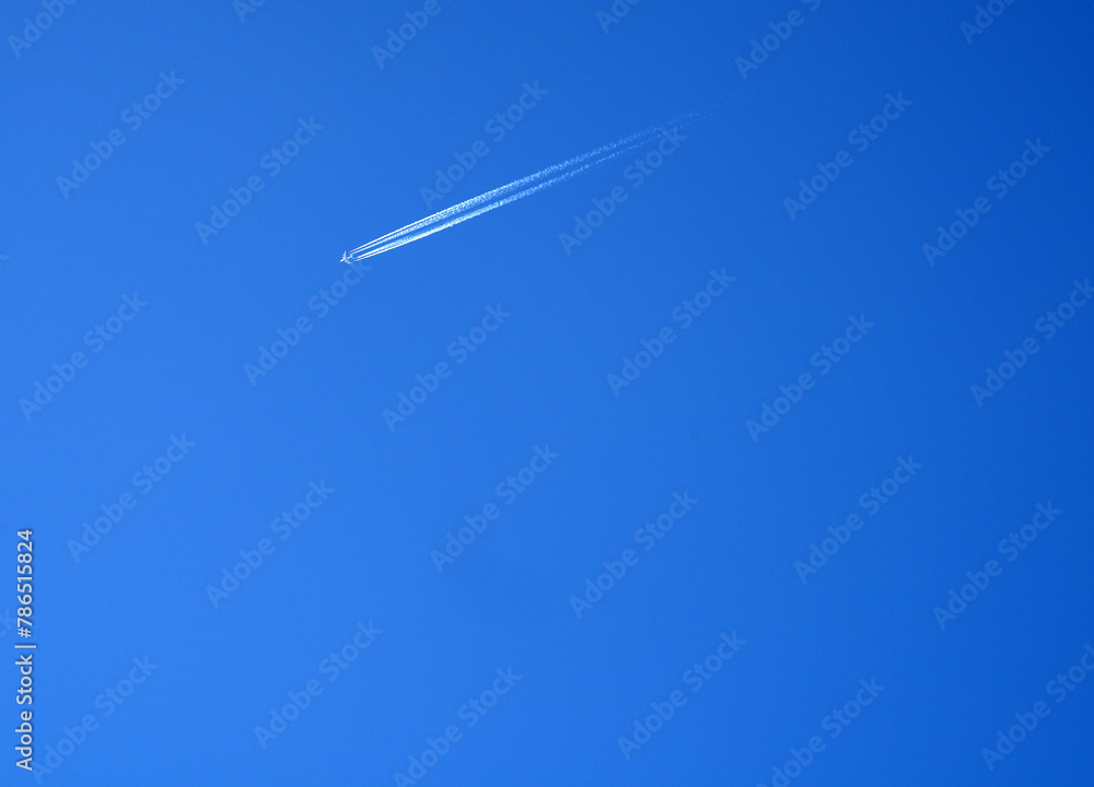 Sharp telephoto close-up of jet plane aircraft with contrails Sharp telephoto close-up of jet plane aircraft with contrails