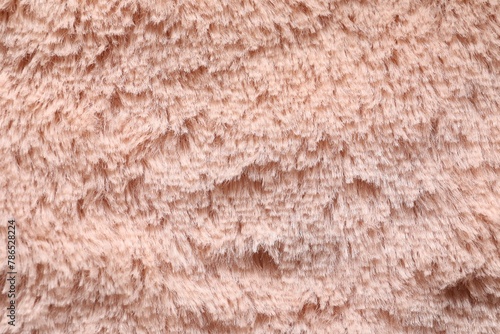 Texture of pink faux fur as background, closeup