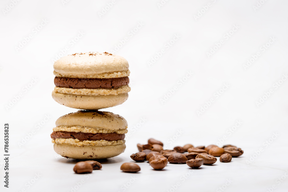 Macaroons with chocolate cream on a light background. Macaroons with chocolate cream on a light background.