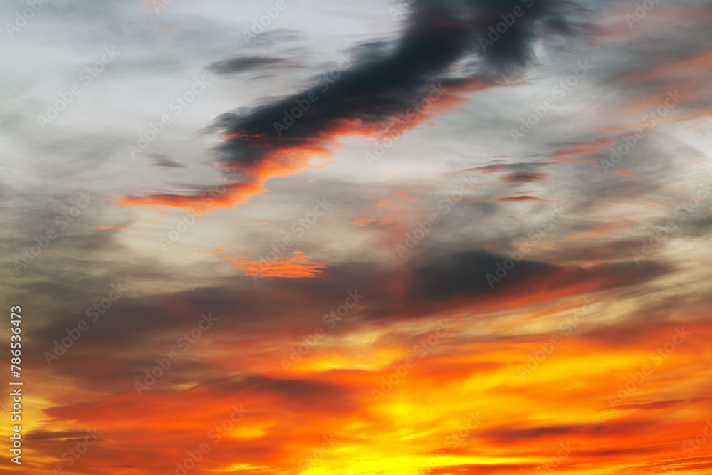 Background of a beautiful bright orange sunset with cirrus clouds Background of a beautiful bright orange sunset with cirrus clouds