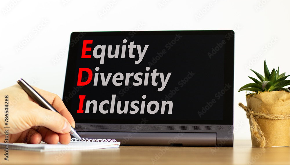 EDI equity diversity inclusion symbol. Concept words EDI equity diversity inclusion on beautiful black tablet. Beautiful white background. Business EDI equity diversity inclusion concept. Copy space. EDI equity diversity inclusion symbol. Concept words EDI equity diversity inclusion on beautiful black tablet. Beautiful white background. Business EDI equity diversity inclusion concept. Copy space.