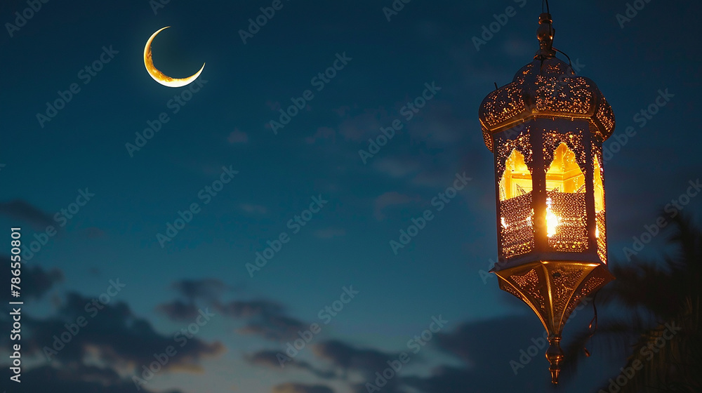 A lantern with a crescent moon above it.

