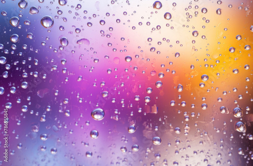 Rainbow-hued background with transparent glass and raindrops  evoking a sense of whimsy and enchantment as vibrant colors blend with the gentle patter of rain