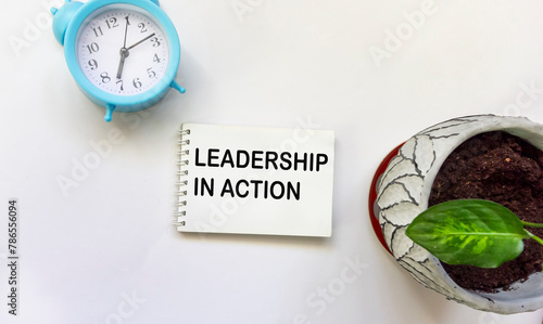 Notepad with text Leadership in Action. Digital Leadership and Management Concept