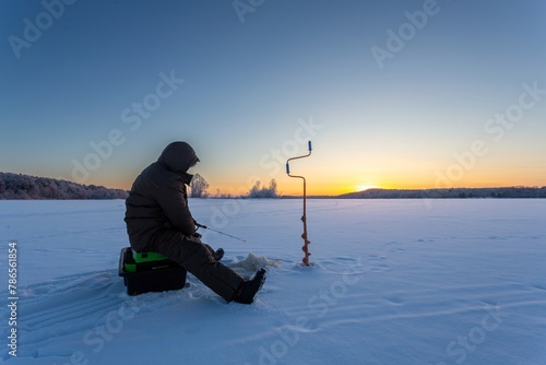 winter fishing in the north, frost at sunset photo