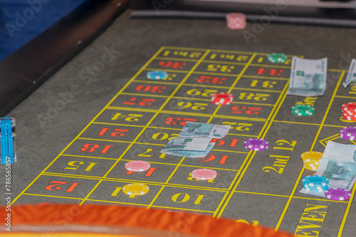 bets in the gambling game roulette: chips and paper money on the gaming table