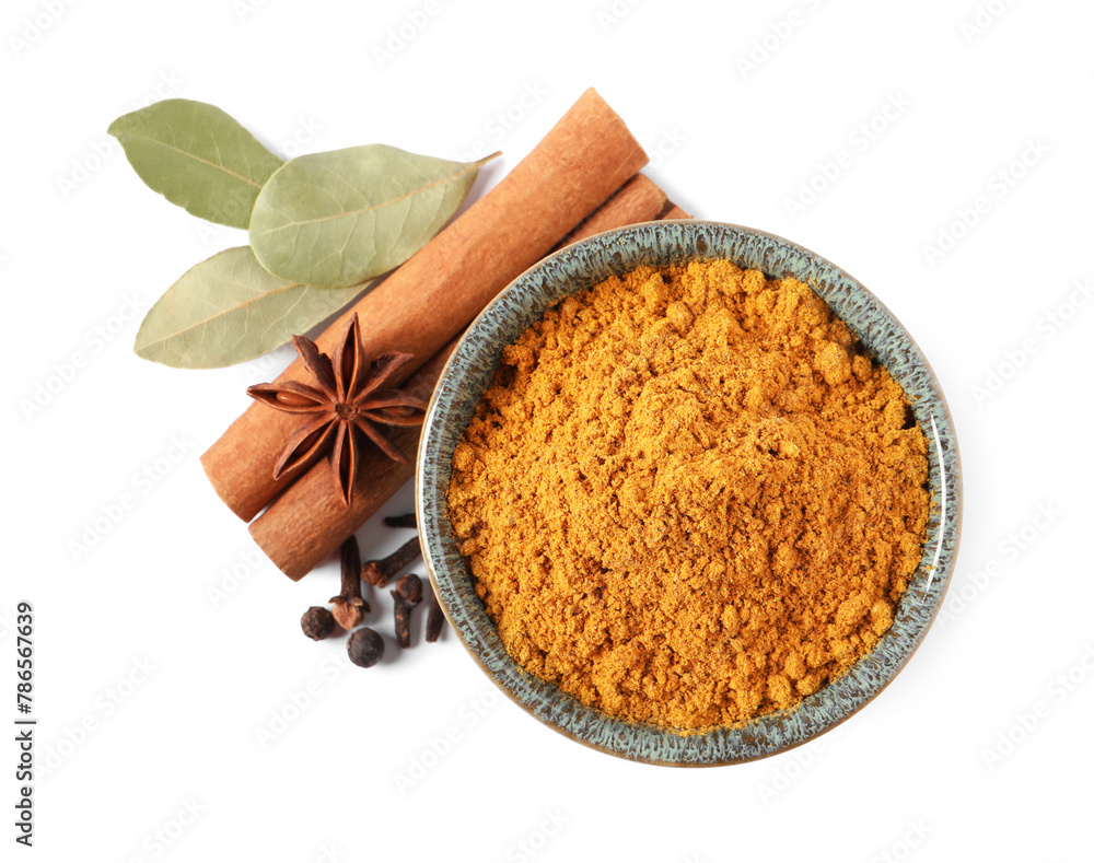 Dry curry powder in bowl and other spices isolated on white, top view Dry curry powder in bowl and other spices isolated on white, top view