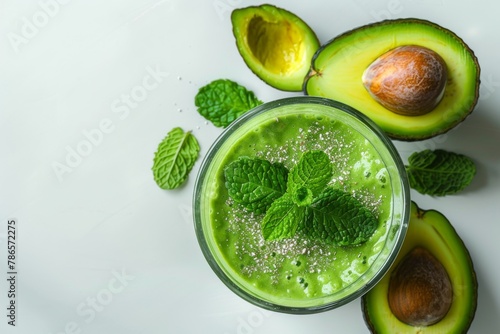 Refreshing avocado smoothie with mint and chia seeds in glass