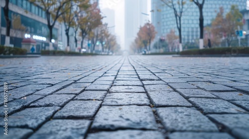 stone paved road on a deserted city street urban background with copy space for text or design