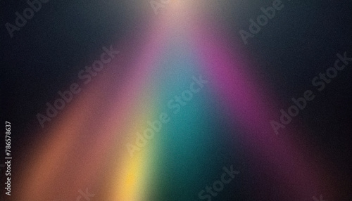 Textured, grainy image showcasing a soft focus rainbow spectrum of light
