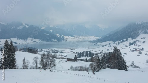 Time lapse, icy lake in the mountains. Winter landscape of frozen Sihlsee Lake. Einsiedeln, canton of Schwyz in Switzerland. photo