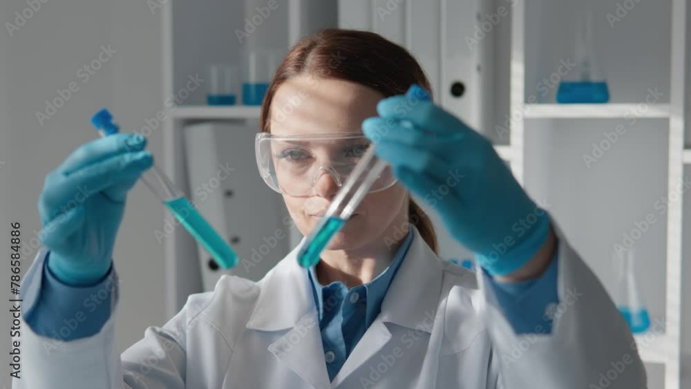 A world of chemistry and biotechnology, where experiments and analyzes pave way for medical advances. Female Lab Assistant Working With Precision, Calling Innovation In Lab On Pharmaceutical Company A world of chemistry and biotechnology, where experiments and analyzes pave way for medical advances. Female Lab Assistant Working With Precision, Calling Innovation In Lab On Pharmaceutical Company