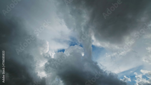 Storm clouds and hole with blue sky