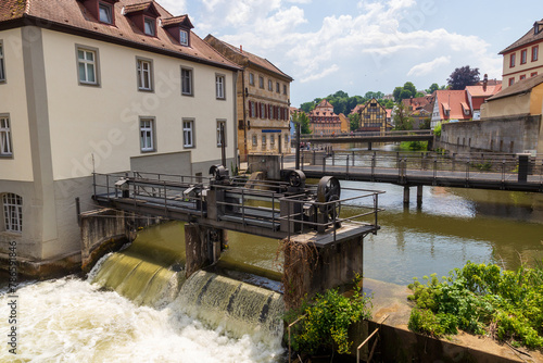 Panorama with bridge and weir at river Regnitz and half-timbered houses in Bamberg, Upper Franconia, Bavaria, Germany