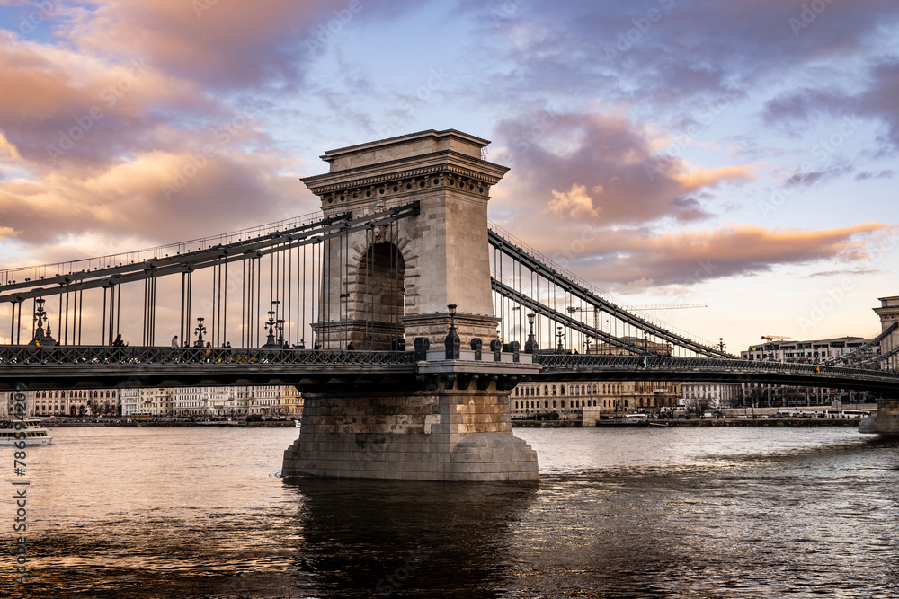 Obraz premium Famous Szechenyi Chain Bridge connecting Buda and Pesta side of Budapest city, hungarian capital, crossing the Danube river
