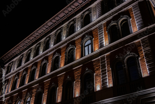 Old building in Budapest city, Hungary, with facade lit by hidden lights