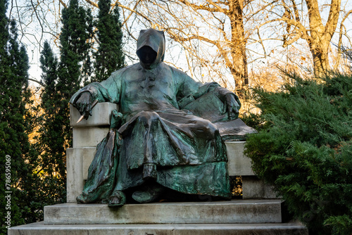 Statue of Anonymus with sharp pen and book, located in Vajdahunyad Castle, Budapest city, Hungary