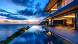 Modern luxury villa exterior with infinity pool and beautiful ocean view at dawn