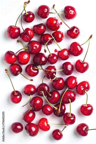 Ripe cherries on a clean white surface, suitable for food and nutrition concepts