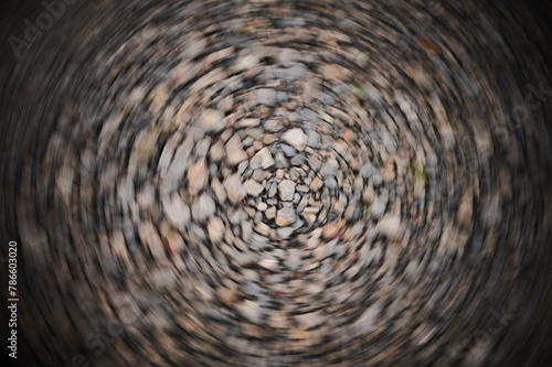 Wallpaper Mural Dynamic swirling ground texture with a series of stones Torontodigital.ca