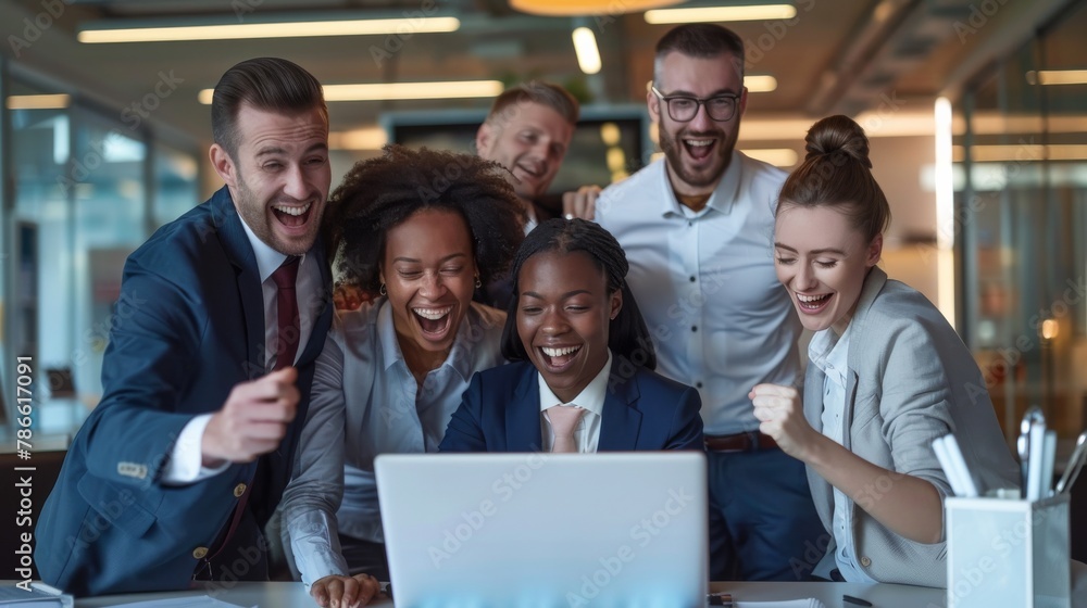 With satisfaction and confidence in their eyes, a team of employees and entrepreneurs look into a laptop to see the results of their joint work.